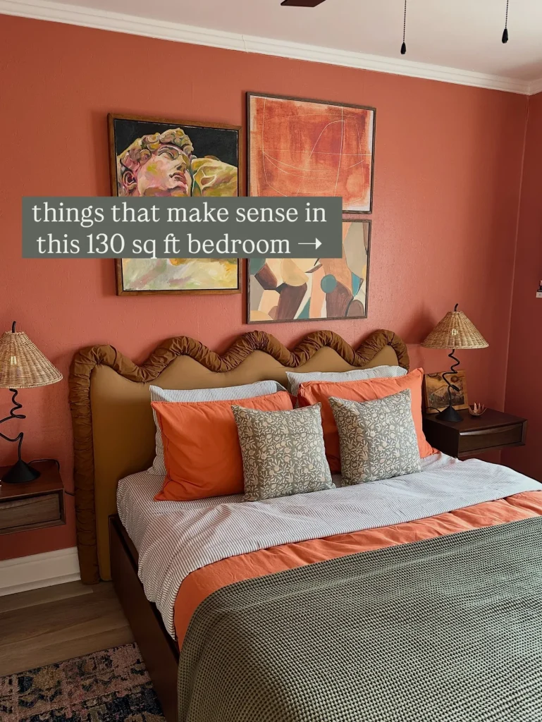 Compact bedroom with narrow furniture, wall sconces, and storage arranged around the bed.